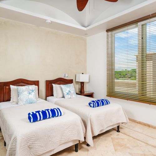 Guest room with two twin beds, that can be pushed together to made a large king bed.