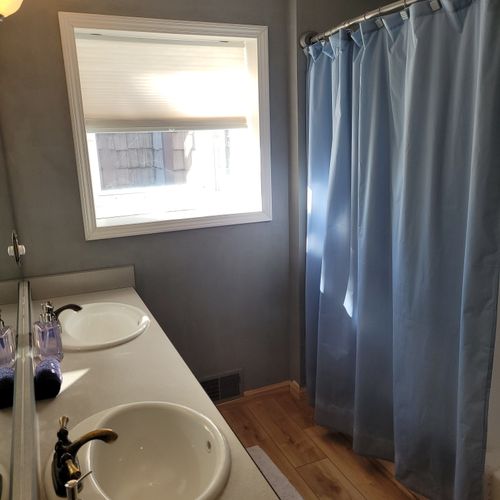 BATHROOM #1 (MAIN FLOOR):  This is a full private ensuite bathroom for Bedroom #1.  It includes a combination tub and shower.