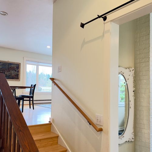 An easy transition between spaces with warm wood details and plenty of natural light—this open stairway keeps the home feeling connected, bright, and welcoming.