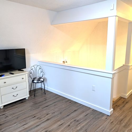 LIVING ROOM #2 (UPPER LEVEL):  Very fun and casual living room / game room on the upper level with a sofa, television, and lots of games in the drawers.