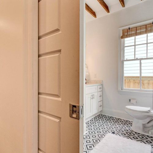 Convenient half bath tucked in & ready for guests.