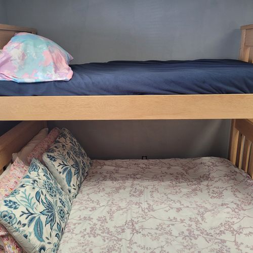 Bedroom:  cute bedroom with a twin-on-full bunk bed, electric heater, fan, 2 dressers, closet, lamp, and a television.