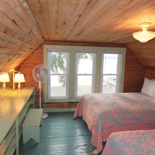 Bedroom #4 (second floor):  features 2 full-size beds, dresser, closet, and great views of crystal lake!