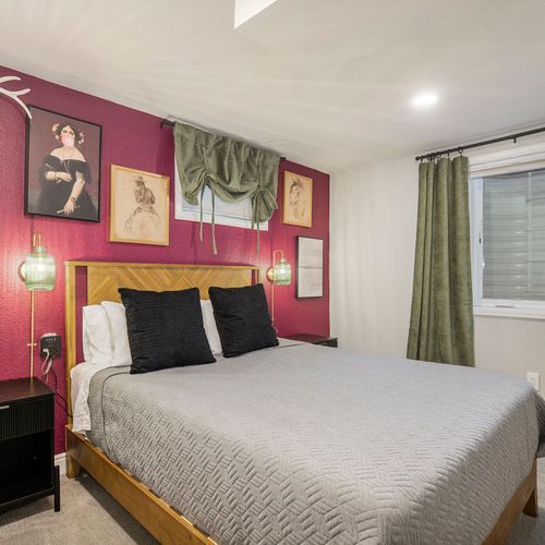 The fourth bedroom features a playful eclectic design, blending vibrant colors and unique decor elements that create a fun and inviting space.