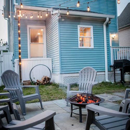 Unwind at night on the bluestone patio, perfect for bonfires under the lights in the heart of Kingston.