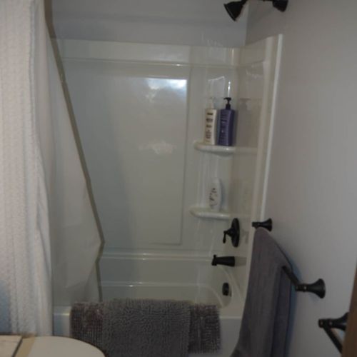 Bathroom #1 (first floor):  full bathroom between the kitchen and the second living room.
