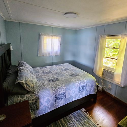 BEDROOM:  The cottage has a lovely bedroom with a beautiful queen-size bed!  Note that there is also a window A/C unit in the bedroom.