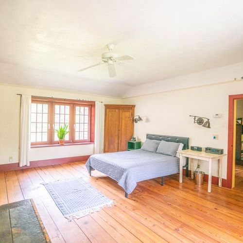 Master bedroom with king-sized bed.