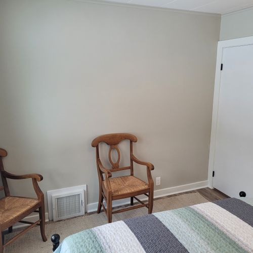 Bedroom #2:  features a queen-size bed, ceiling fan, nightstand, lamp, large closet, and 2 chairs.