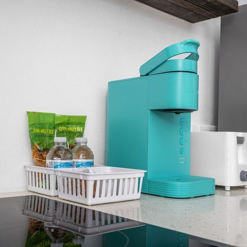 Enjoy a cup of coffee or tea brewed in this kitchen.