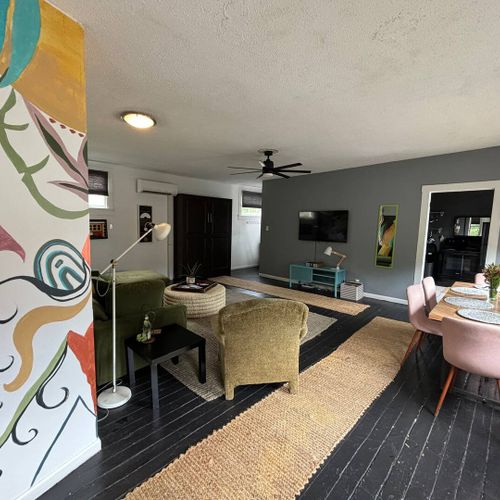 Airy living room w/ eclectic décor & plenty of space to unwind.