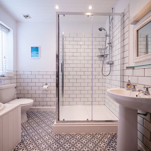 Main shared bathroom with shower and bath