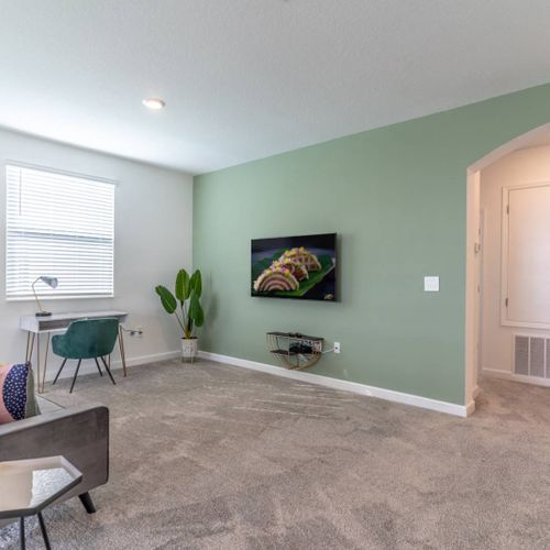 Comfortable & Modern Living Area with Wall Mounted Flat Screen TV