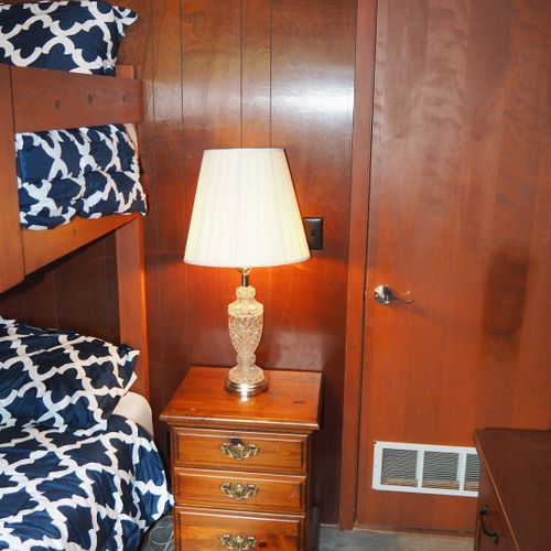 Bedroom #2:  features a full-on-full bunk bed, dresser, closet, and lamps.