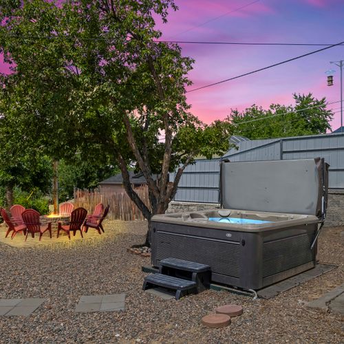 Enjoy the sunset glow while soaking in your private hot tub escape.