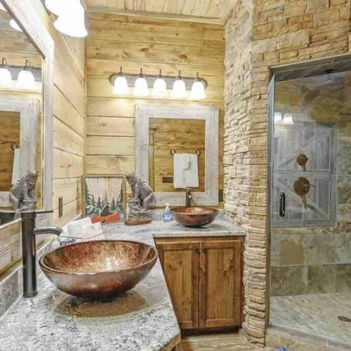 Bathroom attached to Master Suite 5. Features stone walk-in shower & double sink