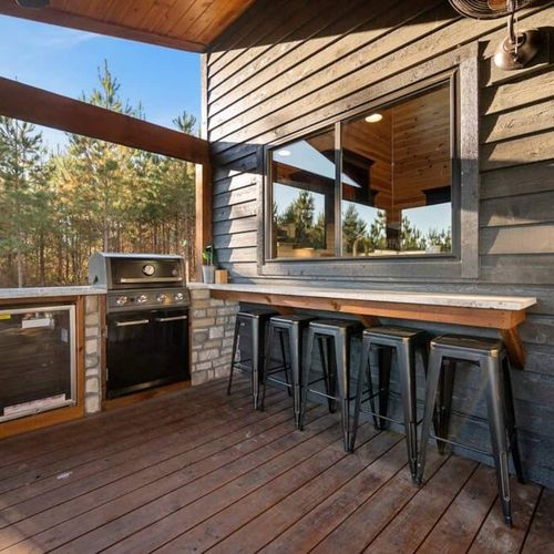 The gas grill and additional outdoor seating!