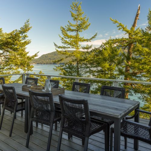 Outdoor seating for twelve guests right outside the dining room makes dining al fresco easy.