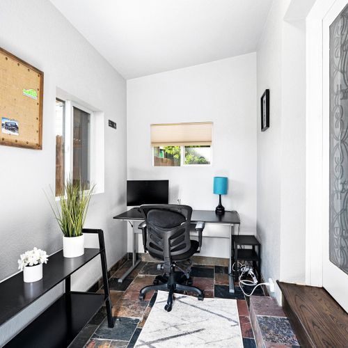 Take advantage of the private office space! It includes a desk, chair, and monitor.