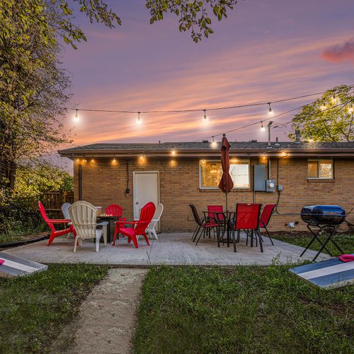 Bask in the fresh colorado air in your private backyard oasis, outfitted with string lights, a new fire table, adirondack seats, dining set, charcoal grill and yard games!