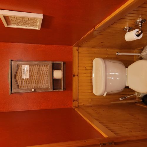 Bathroom #1 (main floor):  cute half-bath with sink, mirror, and toilet on the main floor.