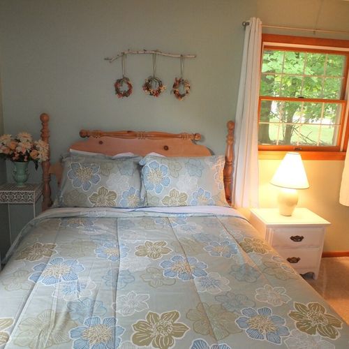 Bedroom #2: features a full-size bed, chair, nightstand, lamp, dresser, and closet.