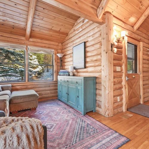 Living room:  the comfy living room with a huge wood fireplace!
