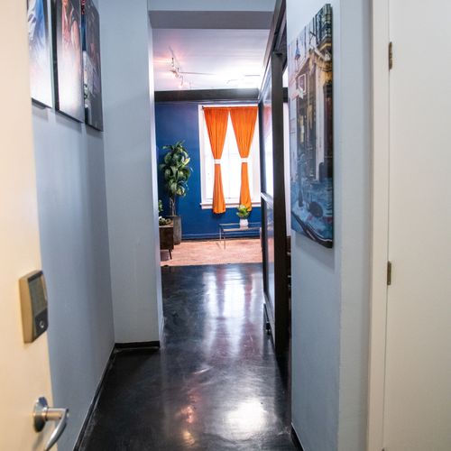 Colorful hallway w/ local artwork — character & charm at every turn.