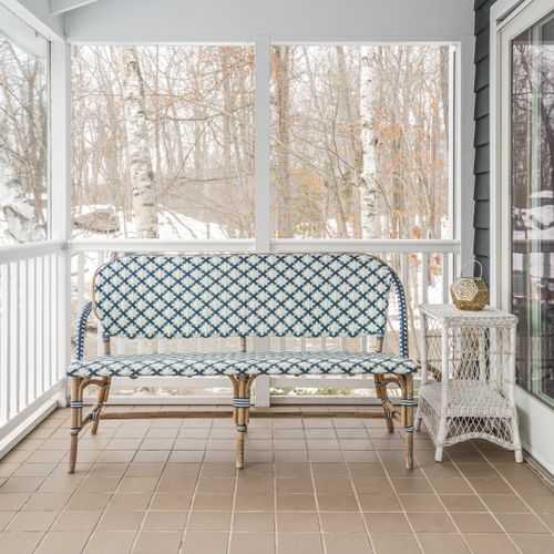 On the screened in porch of the guest house.