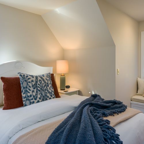 Curl up with a good book, or sleep in. The Yoga Room is a large suite with views of the trees outside.