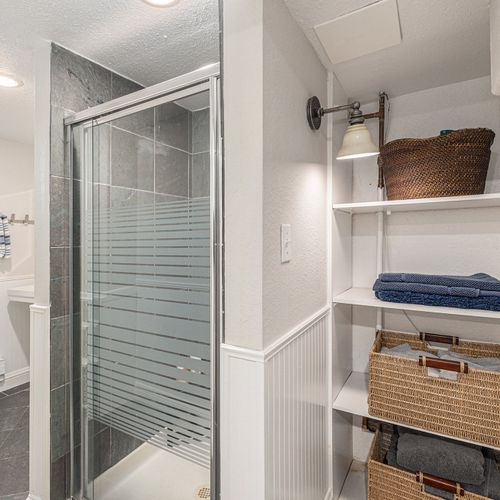 Third bathroom boasting sleek design and modern amenities