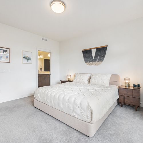 Soft white and blue shades define this restful space, with a king bed and a private bathroom for your comfort.