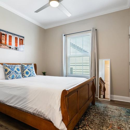 Bright bedroom w/ a full-length mirror & closet — everything you need to settle in.