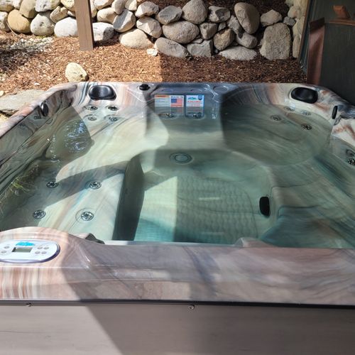 Overall:  the brand new 4-person hot tub / spa at the property. (it's  just outside the door to the backyard patio. )