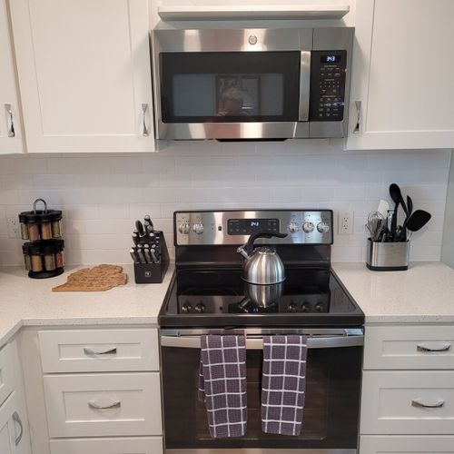 Kitchen:  there is a full kitchen with all-new stainless steel appliances (including a dishwasher), a good supply of cooking and dining utensils, and lots of cupboard and counter space.