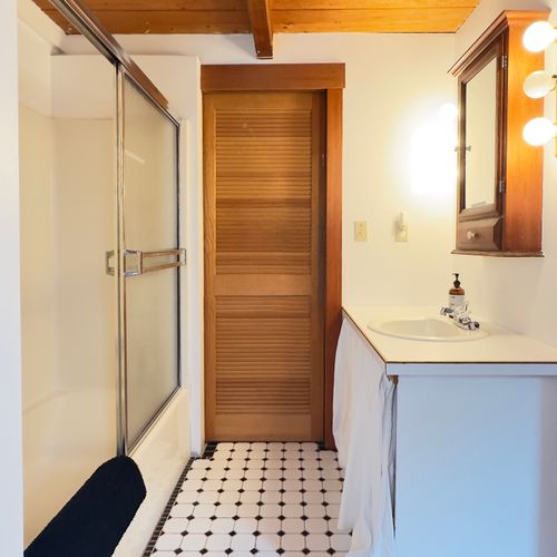 Downstairs full bath connects to the living room.