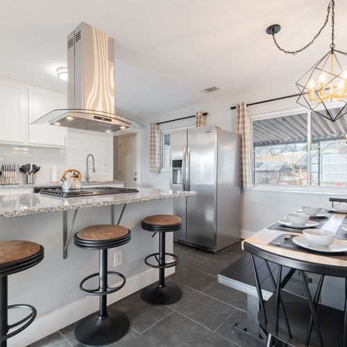 The kitchen boasts beautiful new countertops, sleek cabinets and stainless steel appliances.