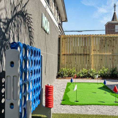 Challenge your friends to a life-sized Connect Four game or practice your putting skills in this fun-filled corner of the backyard.