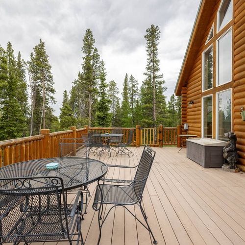 - enjoy outdoor dining or drinks on this spacious forest view deck with iron seating
- surrounded by pines, it’s the perfect spot for peaceful meals or stargazing nights
- step outside and soak in the fresh mountain air from sunrise to sunset