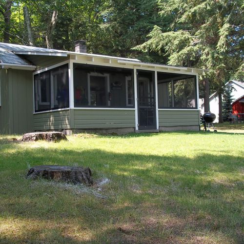 Exterior:  the front porch of the cabin in summer
