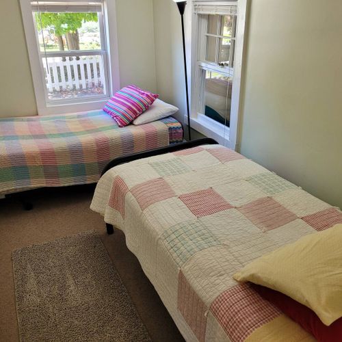 BEDROOM #2:  Features 2 twin-size beds.  (Note that there is no door to the bedroom.  There is only a curtain.)