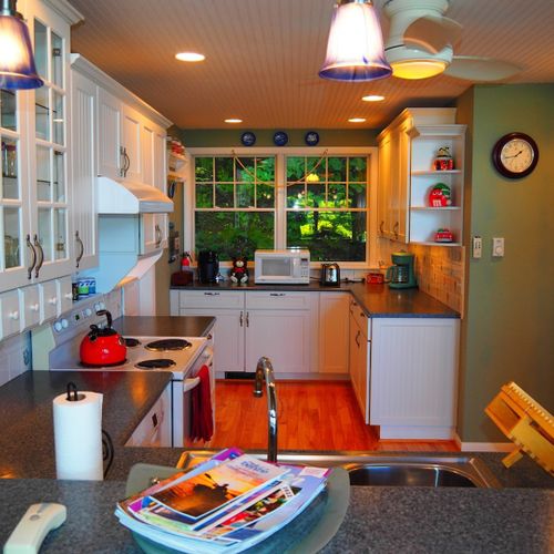 Kitchen:  the home has a large, beautiful, and very functional kitchen with all appliances including a dishwasher. There is a good supply of cooking and dining utensils included as well.
