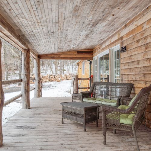 The covered front porch is the perfect place to enjoy a cup of coffee or tea in the morning