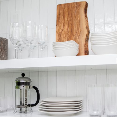 Dishware and glassware located in the kitchen.