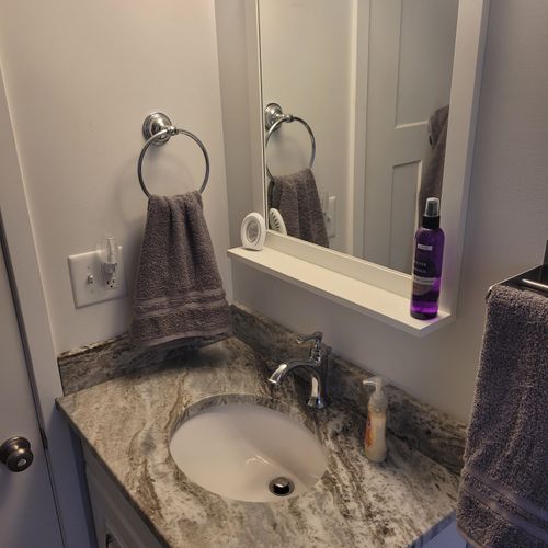 Bathroom #2:  full common bathroom on the main floor with a combination tub and shower.