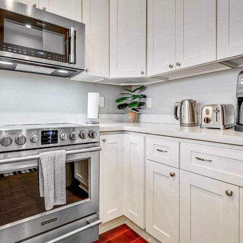 Fully stocked kitchen w/ modern appliances & ample prep space for home-cooked meals.