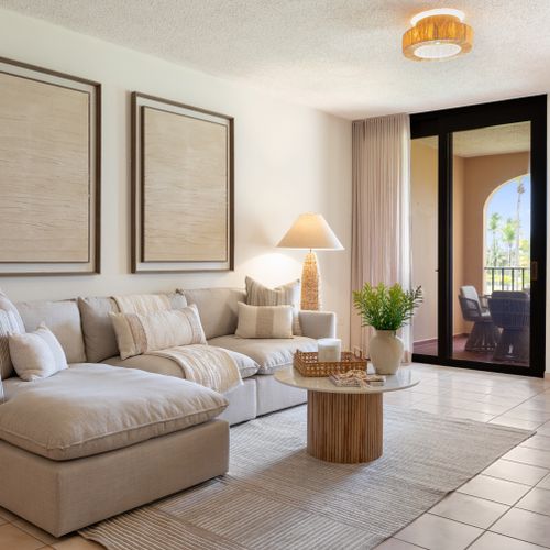 Relax in style! Our spacious living area with plush sectional sofa offers comfort and connection to the dining space.