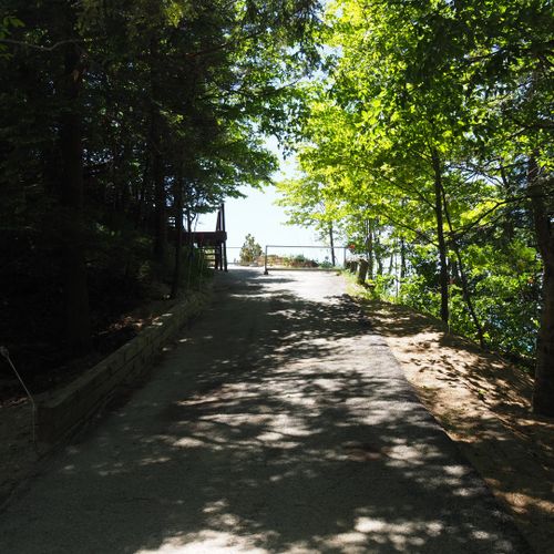 Exterior:  driveway leading up to the house. Cars cannot proceed past steps.
