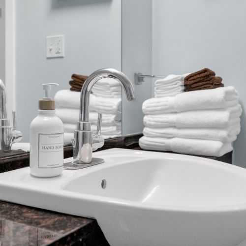 Refresh and rejuvenate in our spotless bathroom, fully stocked with plush towels and premium amenities for your comfort.