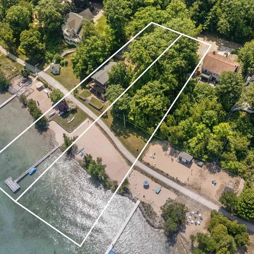 OVERVIEW:   The home actually occupies 2 lots on Crystal Lake, which provides for a large and incredible private sandy beach!